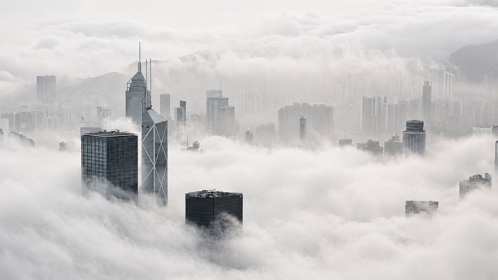 Hong Kong skyline emerging from sea fog at sunrise — a view across the company's regional footprint